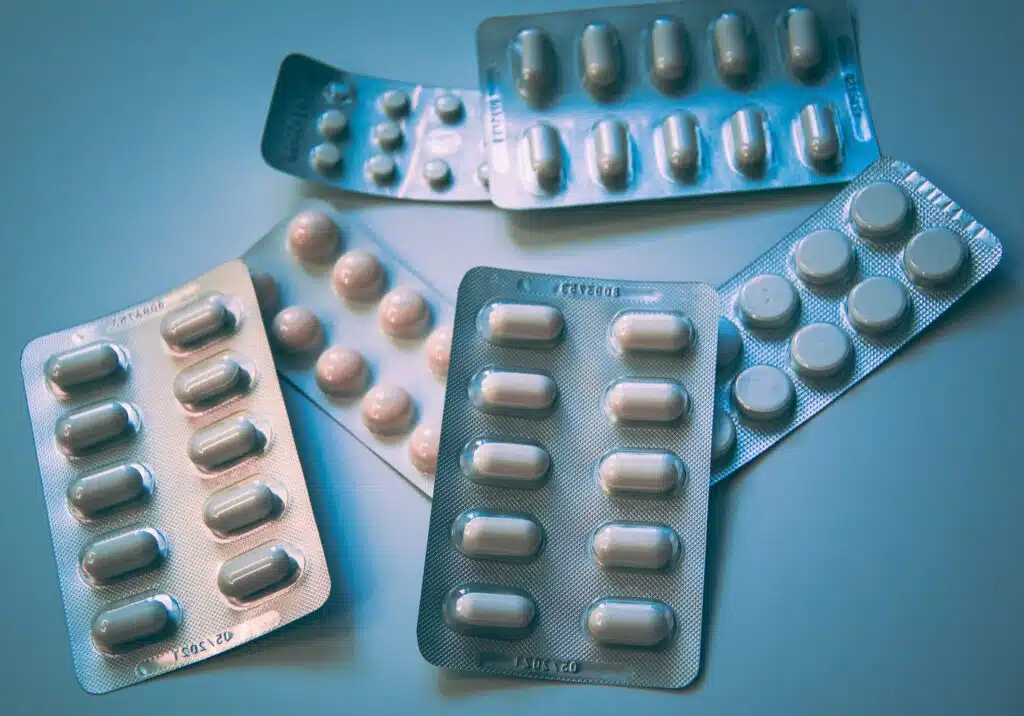 white and blue medication pill blister pack